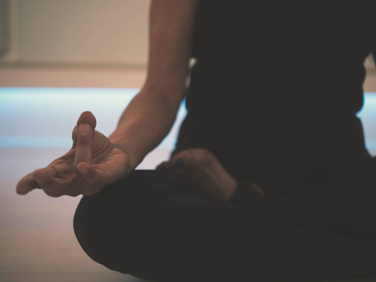 Beginner practicing consistent meditation tips with morning coffee ritual